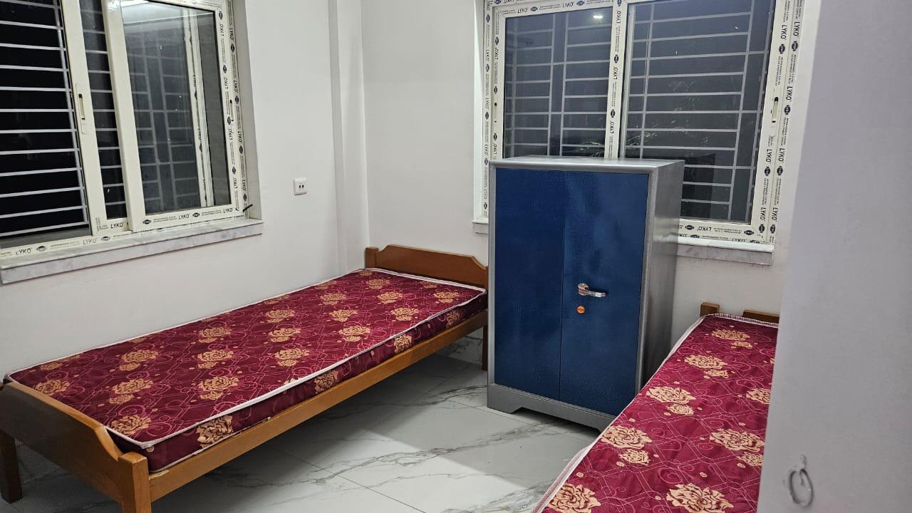 Twin sharing room with steel wardrobe