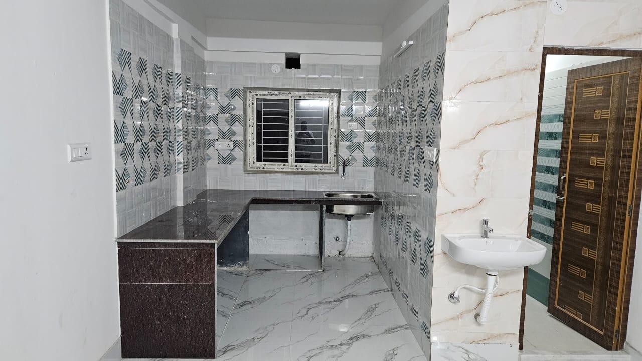 Clean kitchen area with sink and counter